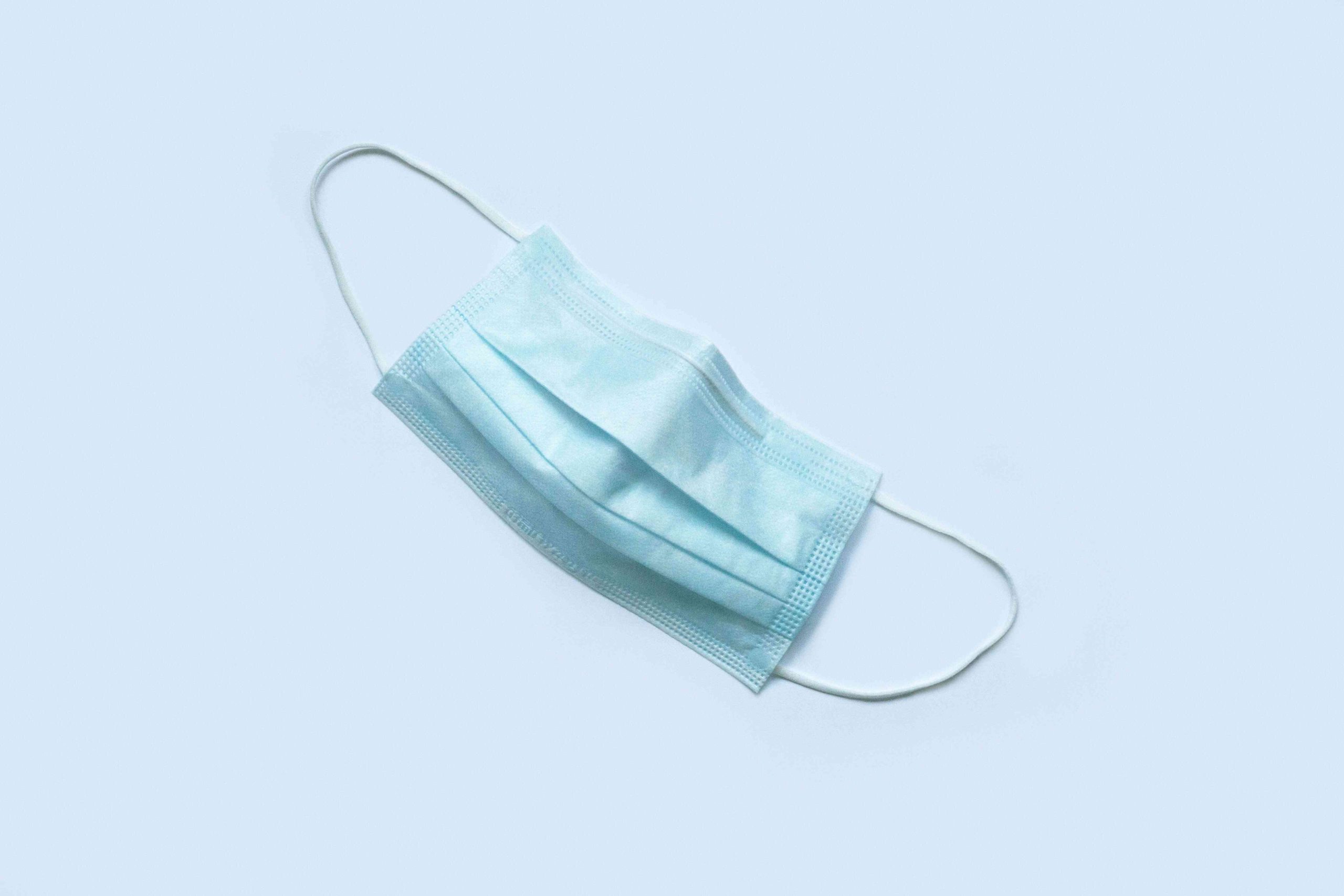 surgical mask on blue background