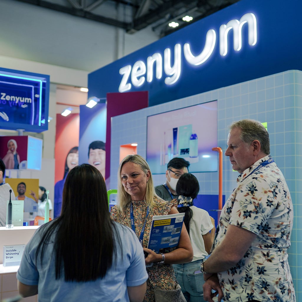 Delegates at Zenyum booth getting to know products