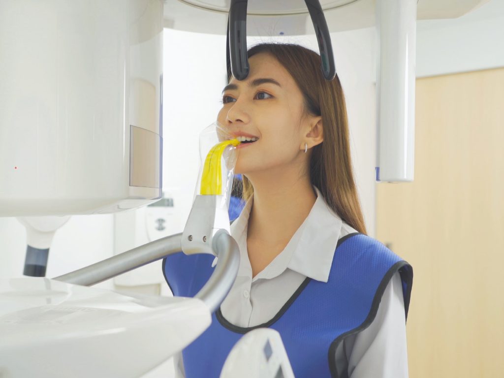 Woman getting dental scan at dentist
